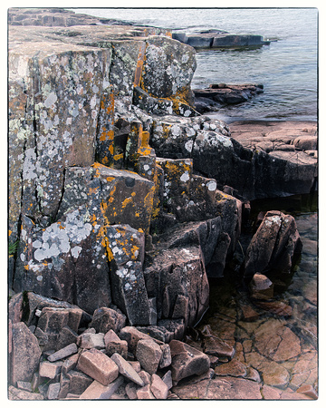 Lichen-encrusted basalt at Artists' Point as a vintage photograph