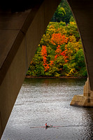 Single shell rower under the Lake Street Bridge